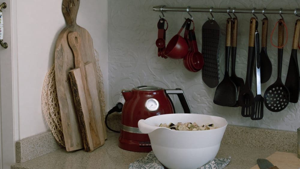 Vegetable scraps in a bowl on a kitchen counter