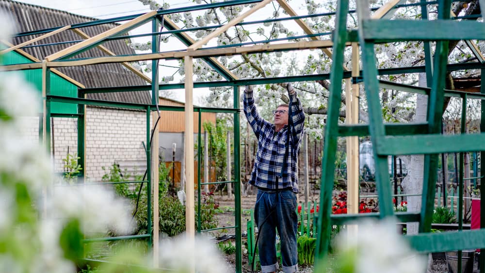 A greenhouse frame partway through assembly